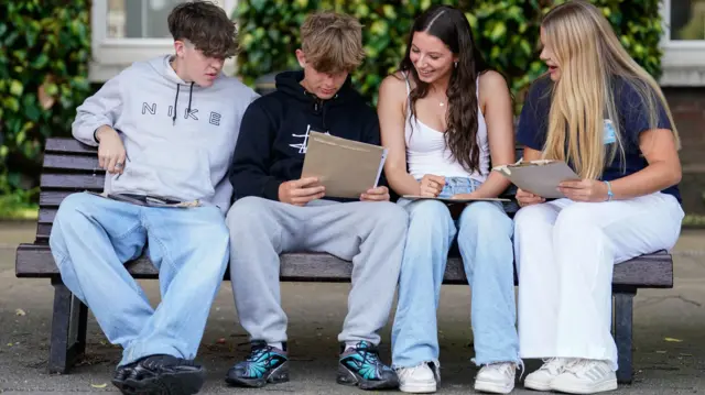 James Smith, Elias Stisted, Katherine Edwards and Emily Farrar with their results at Portsmouth Grammar School, Hampshire