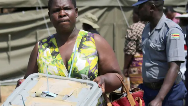 Zimbabwe Electoral Commission (ZEC) official carries a ballot box of presidential elections from a polling station to a command centre in Harare, Zimbabwe - 24 August 2023