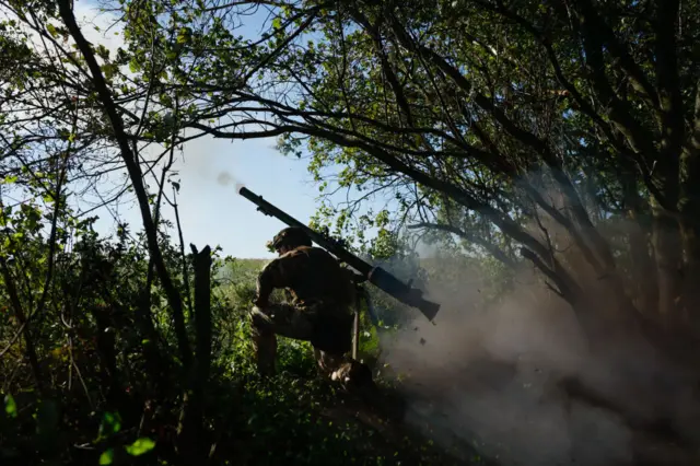 A Ukrainian soldier fires an anti-tank gun