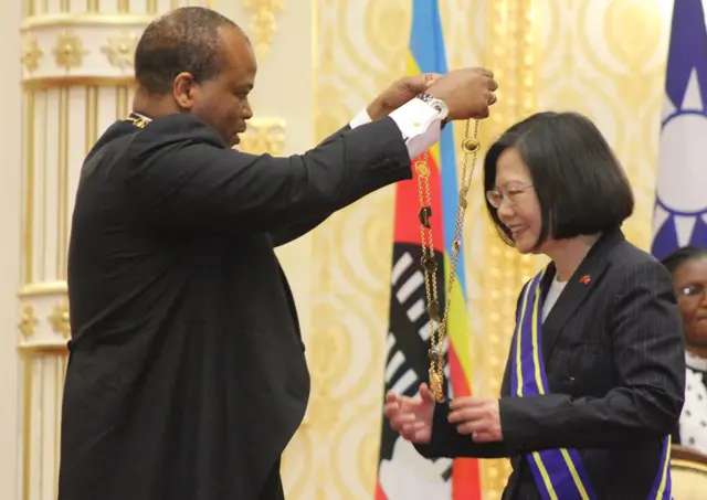 Swaziland absolute Monarch King Mswati III (L) bestows the Order of the Elephant to Taiwan President Tsai Ing-wen (R) during her visit to the Kingdom of Swaziland at an official ceremony on April 18, 2018 in Lozitha Palace, Manzini.