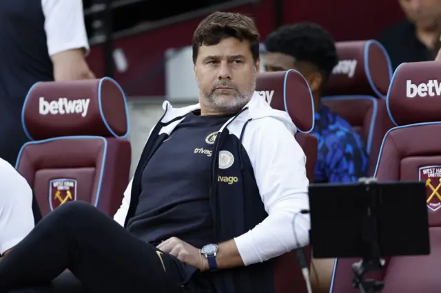 Mauricio Pochettino sits on the bench ahead of the West Ham match.