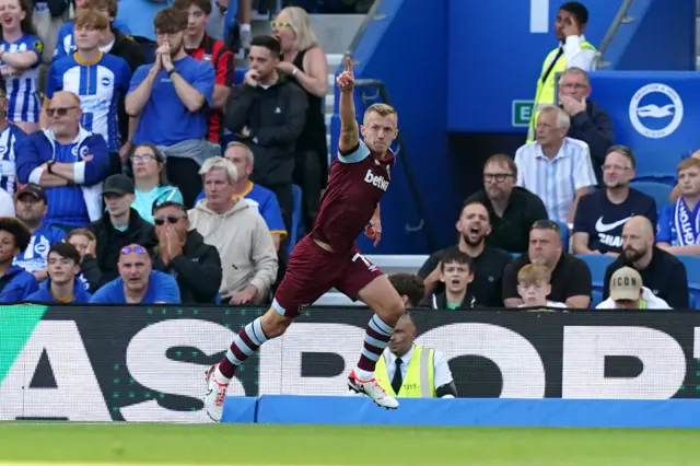 Ward Prowse points to the sky while running to celebrate.