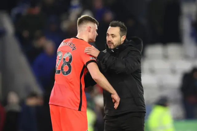 Ferguson and De Zerbi embrace after winning the game.