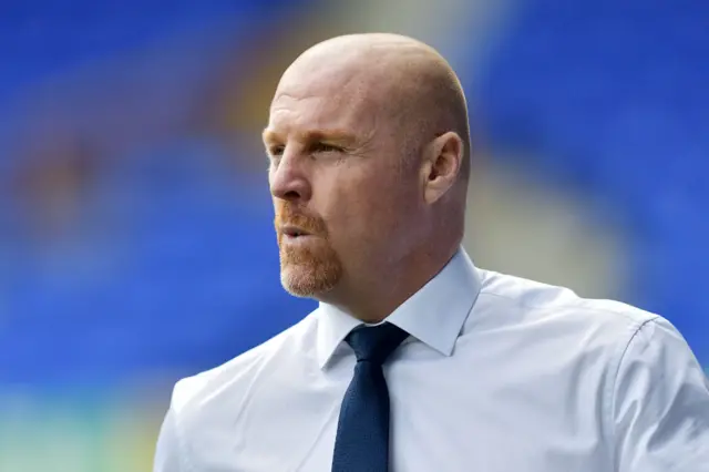 Sean Dyche whistles as he arrives at Goodison Park.