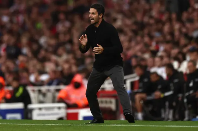 Arteta shouts instructions to his players from the sidelines.