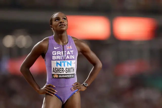 Dina Asher-Smith with her hands on her hips