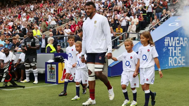 Courtney Lawes leads out England