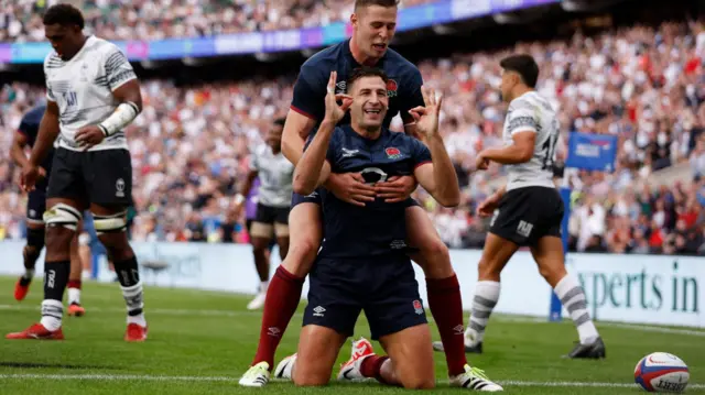 Jonny May celebrates a try