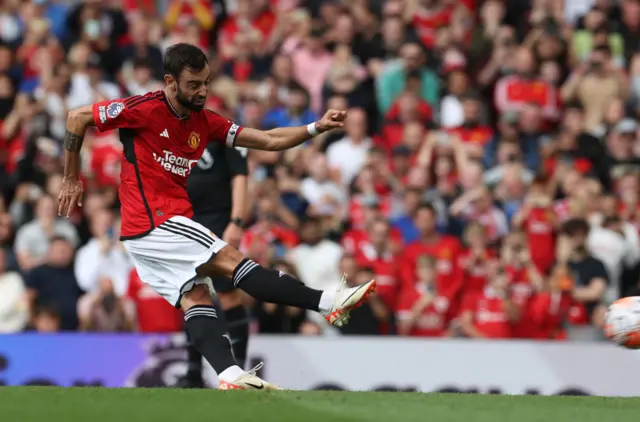 Bruno Fernandes strikes at goal from the penalty spot.