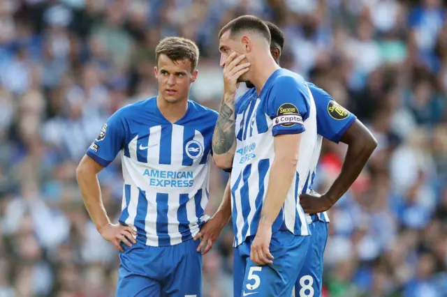 Brighton duo Solly March and Lewis Dunk in deep discussion during Brighton's Premier League game at home to West Ham United