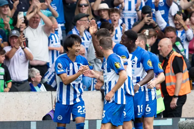 Mitoma and teammates celebrate his goal at wolves.