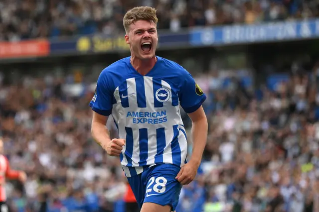 Ferguson runs and shouts in delight after scoring.