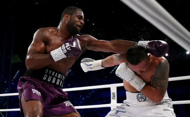 Daniel Dubois throws a punch at Oleksandr Usyk