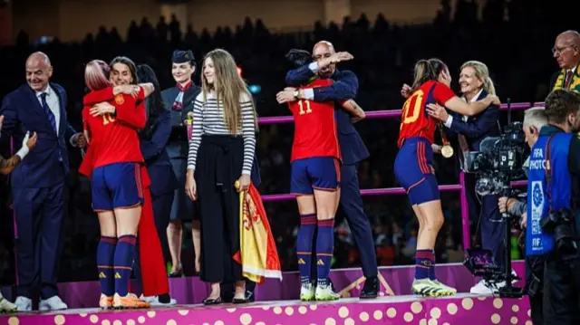 Image shows embrace between Rubiales and Hermoso