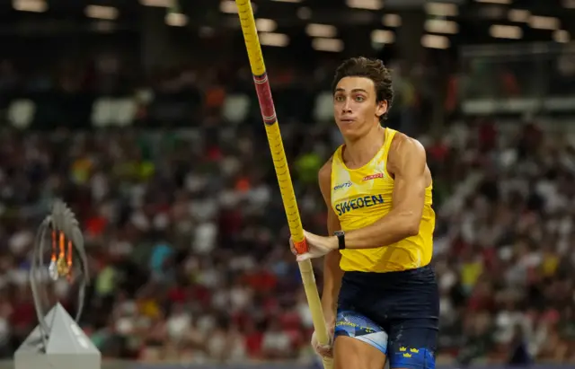 Armand Duplantis sprints during the pole vault final.