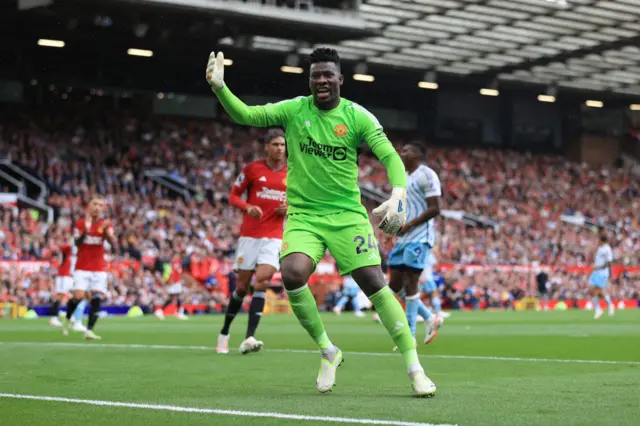 Onana shouts for the ball from the ball boys and girls.