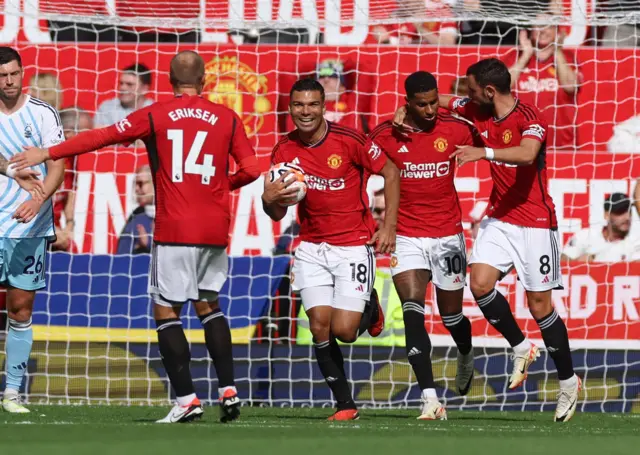 Manchester United's Casemiro celebrates scoring their second goal with Bruno Fernandes and Marcus Rashford