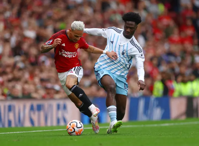 Nottingham Forest's Ola Aina in action with Manchester United's Antony