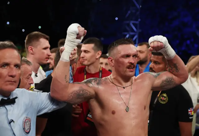 Oleksandr Usyk celebrates