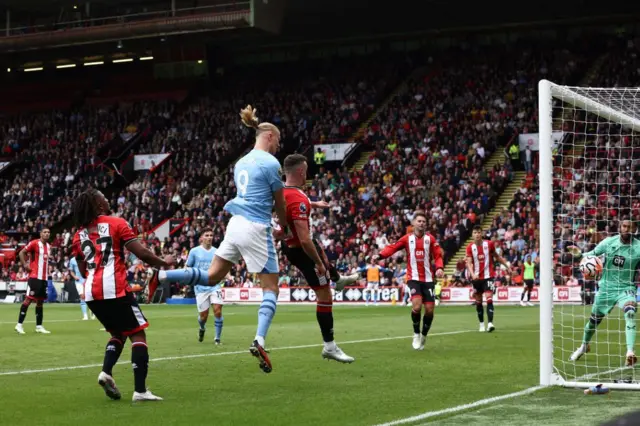 Haaaland rises highest to head into the goal past Foderingham.