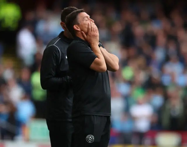 Heckingbottom reacts to a chance by holding his hands to his mouth.