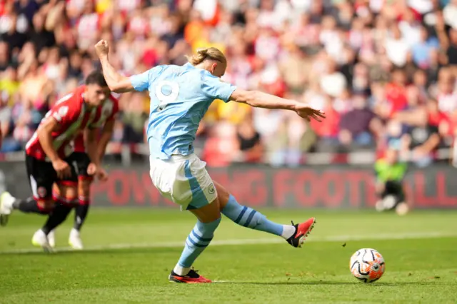 Haaland strikes at goal from the penalty spot.