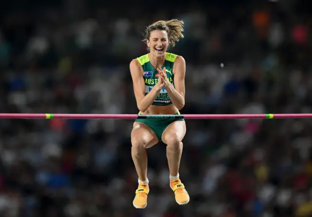 Nicola Olysagers celebrates mid-air as she clears the bar in the women's high jump final