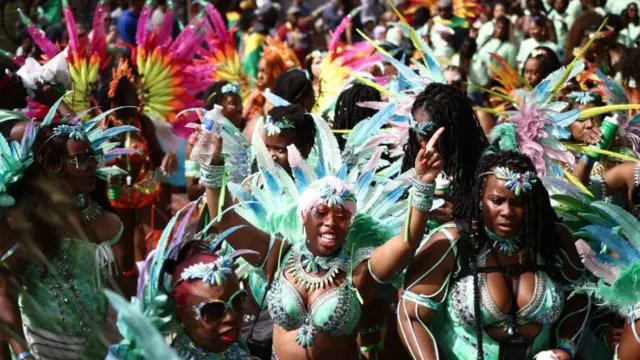 Performers taking part in the adults parade, part of the Notting Hill Carnival celebration