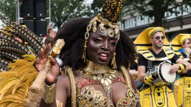 Performers parade in costume on the final day of Notting Hill Carnival