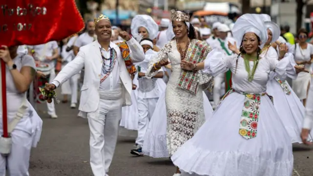 Performers parade in costume on the final day of Notting Hill Carnival