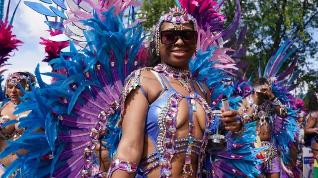 Performers taking part in the adults parade, part of the Notting Hill Carnival celebration