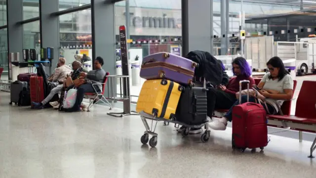 Passengers waiting at Heathrowq