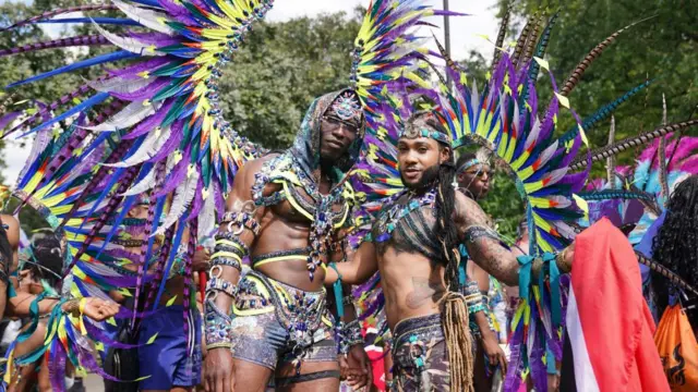 Performers taking part in the adults parade, part of the Notting Hill Carnival celebration in west London