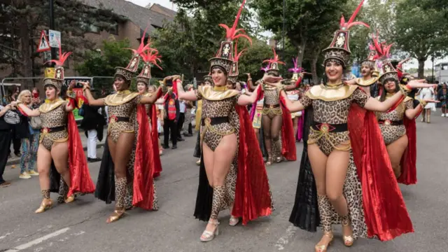 Performers parade in costume on the final day of Notting Hill Carnival