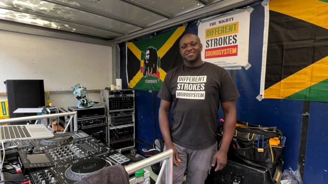 Riper Don smiles beside sound mixing equipment