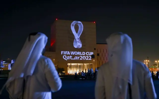 The Fifa World Cup logo beamed onto a wall in Doha, Qatar.