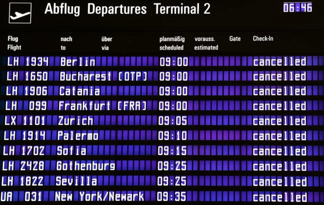 Flight departure board showing cancellations at Munich Airport