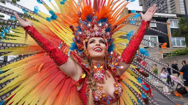 Performers taking part in the adults parade, part of the Notting Hill Carnival celebration