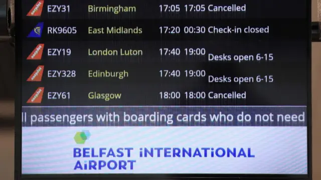 Departures board shows cancelled flights from Belfast Airport