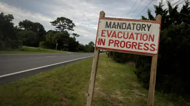 A  mandatory evacuation sign is seen ahead of the arrival of Hurricane Idalia