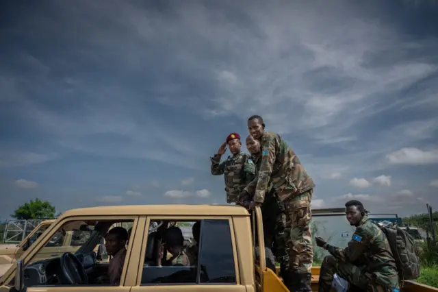 Soldiers of the Somali National Army (SNA) and Somalia security forces load onto vehicles at the airport in Baidoa, Somalia, on November 9, 2022.