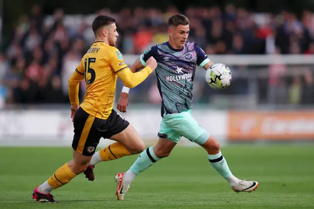 Josh Seberry of Newport County and Yegor Yarmolyuk of Brentford compete for the ball