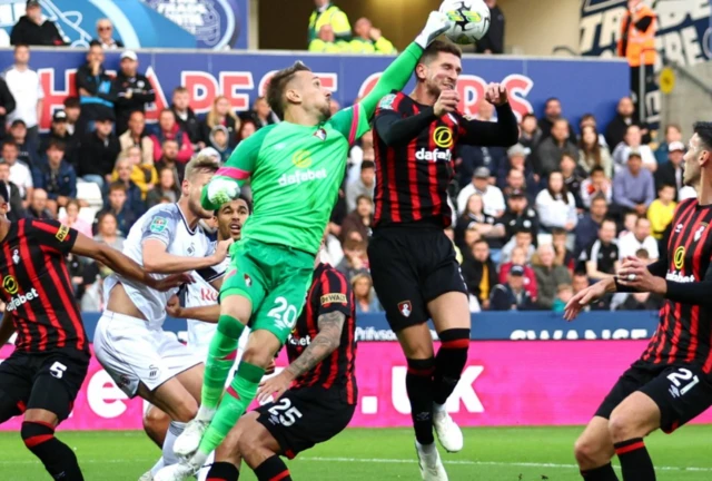 AFC Bournemouth's Andrei Radu punches the ball away