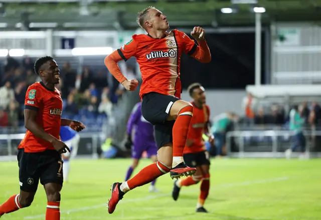 Cauley Woodrow of Luton Town celebrates after scoring the team's third goal