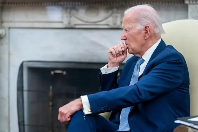 Joe Biden sat down in a blue suit