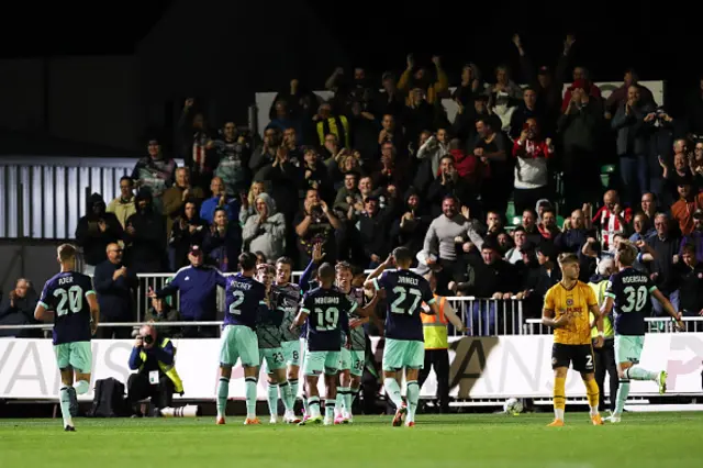 Mathias Jensen of Brentford celebrates with his teammates after scoring the team's first goal