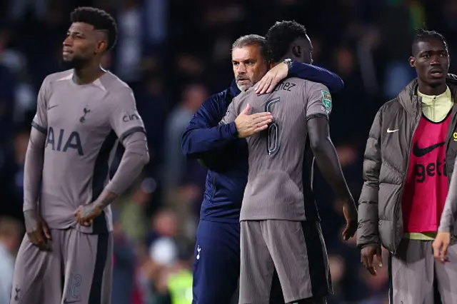 Ange Postecoglou, Manager of Tottenham Hotspur, consoles Davinson Sanchez of Tottenham Hotspur after losing in the penalty shoot out