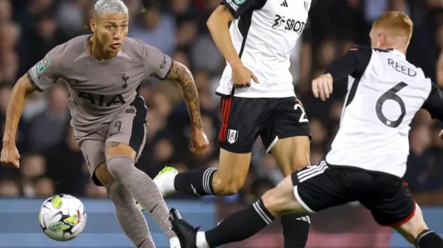 Tottenham Hotspur's Richarlison in action with Fulham's Joao Palhinha and Harrison