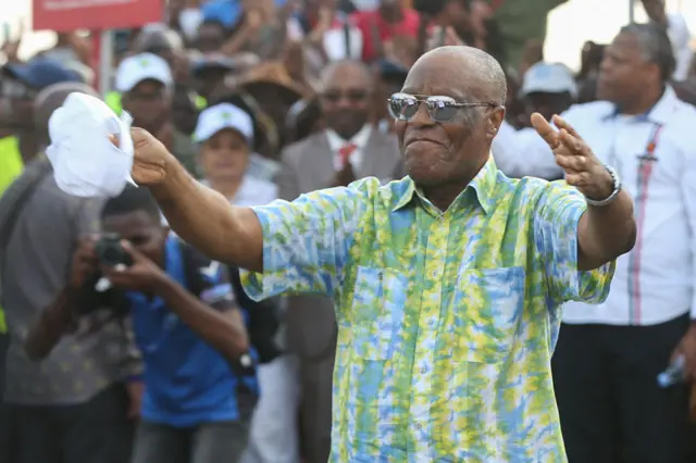 Albert Ondo Ossa, the leader of Gabon's main opposition coalition Alternance 2023, dances during a campaign meeting in Libreville on August 20, 2023.