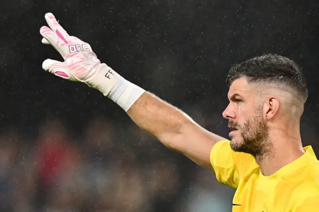 Fraiser Forster with an arm aloft while in net for Spurs this evening